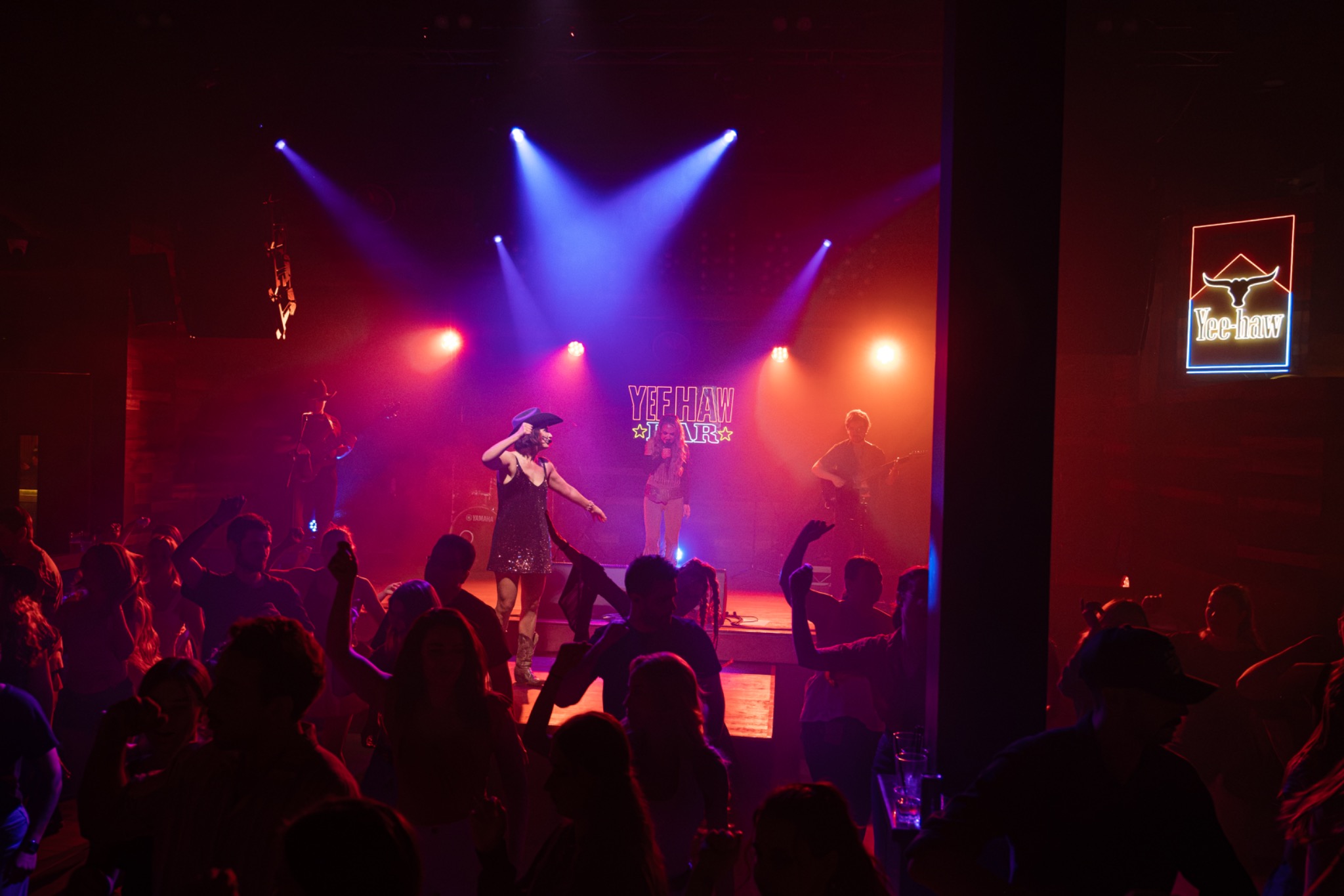 Crowd dancing together to the live band